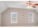 Bonus room featuring two windows bringing in natural light and neutral color scheme at 485 Sutro Forest Nw Dr, Concord, NC 28027