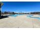 Community pool with wading area surrounded by a concrete deck at 485 Sutro Forest Nw Dr, Concord, NC 28027