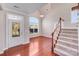 Elegant foyer with hardwood floors, decorative front door, and staircase at 485 Sutro Forest Nw Dr, Concord, NC 28027