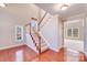 Grand foyer with hardwood floors, staircase, and ample natural light at 485 Sutro Forest Nw Dr, Concord, NC 28027