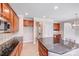 Kitchen with cherry cabinets, granite countertops, tile backsplash, and stainless steel appliances at 485 Sutro Forest Nw Dr, Concord, NC 28027