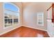 Sunlit living room with hardwood floors and large arched window at 485 Sutro Forest Nw Dr, Concord, NC 28027