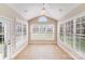 Bright sun room with large windows and tile flooring at 485 Sutro Forest Nw Dr, Concord, NC 28027