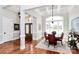 Elegant dining room with coffered ceilings, large windows, and hardwood floors, perfect for entertaining and everyday meals at 5086 Windward Point Ln, Denver, NC 28037