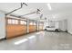 Spacious three car garage with epoxy floors and high ceilings at 5086 Windward Point Ln, Denver, NC 28037