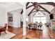 Spacious living room with stone fireplace, hardwood floors, and picturesque views at 5086 Windward Point Ln, Denver, NC 28037