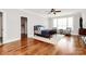 Serene bedroom features hardwood floors, a large window, and stylish decor at 5086 Windward Point Ln, Denver, NC 28037