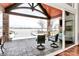 A covered patio with stone pillars and water views. An inviting space for outdoor lounging at 5086 Windward Point Ln, Denver, NC 28037
