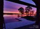 Spectacular sunset view over the water from a covered patio at 5086 Windward Point Ln, Denver, NC 28037