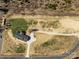 Overhead view of a home with a circular driveway on a vast, partially grassy lot at 515 Panhandle Rd, Gold Hill, NC 28071