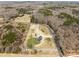 Aerial view shows a home on a spacious lot with a long driveway and natural surroundings at 515 Panhandle Rd, Gold Hill, NC 28071