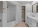 Bright renovated bathroom with a shower, closet and double vanity at 515 Panhandle Rd, Gold Hill, NC 28071