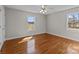 Sun-filled bedroom featuring two windows and hardwood floors at 515 Panhandle Rd, Gold Hill, NC 28071