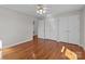 Bedroom featuring three closets, a ceiling fan and hardwood floors at 515 Panhandle Rd, Gold Hill, NC 28071