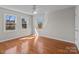 Bright bedroom featuring three windows and hardwood floors at 515 Panhandle Rd, Gold Hill, NC 28071