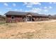 A lovely brick house features a durable metal roof, complemented by a well-kept lawn and inviting curb appeal at 515 Panhandle Rd, Gold Hill, NC 28071