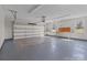 Clean, empty garage with ample space, work benches, and an automatic door opener at 515 Panhandle Rd, Gold Hill, NC 28071