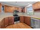 Well-lit kitchen features wood cabinets, stainless steel appliances and a window at 515 Panhandle Rd, Gold Hill, NC 28071