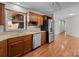 Bright kitchen with stainless steel dishwasher and refrigerator and laminate countertops at 515 Panhandle Rd, Gold Hill, NC 28071