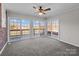 Large living room boasts carpet and multiple sliding glass doors to a deck at 515 Panhandle Rd, Gold Hill, NC 28071