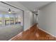 Open living room features carpet, hardwood floors, and sliding glass doors to deck at 515 Panhandle Rd, Gold Hill, NC 28071