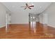 Spacious living room with beautiful hardwood floors, ceiling fan, and neutral paint, perfect for relaxation and entertaining at 515 Panhandle Rd, Gold Hill, NC 28071