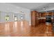 Open living area flows into a well-equipped kitchen, featuring hardwood floors and natural light at 515 Panhandle Rd, Gold Hill, NC 28071