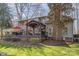 Backyard with an outdoor dining area, a covered seating area, and a lush green lawn at 5213 Wood Lake Dr, Belmont, NC 28012