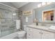 Stylish bathroom with a tub-shower combo, sleek white vanity, and modern tile accents at 5213 Wood Lake Dr, Belmont, NC 28012