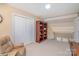 Upstairs bonus room featuring neutral carpet, built in book shelves and natural light at 5213 Wood Lake Dr, Belmont, NC 28012