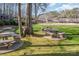 Common area includes several stone picnic tables and benches perfect for neighborhood get togethers at 5213 Wood Lake Dr, Belmont, NC 28012