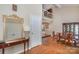 Dining room with wood floors, wainscotting, large mirror, and view of the 2nd story loft at 5213 Wood Lake Dr, Belmont, NC 28012