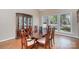 Dining room with wood floors, China cabinet, large windows with a view of the backyard at 5213 Wood Lake Dr, Belmont, NC 28012