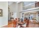 Dining room with wood floors, wainscotting, and open floor plan to kitchen and living spaces at 5213 Wood Lake Dr, Belmont, NC 28012