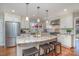 Kitchen with stainless steel appliances, granite countertops, island with seating, and pendant lights at 5213 Wood Lake Dr, Belmont, NC 28012