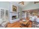 Bright living room with fireplace, hardwood floors, and open access to the kitchen at 5213 Wood Lake Dr, Belmont, NC 28012