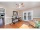 Office with wood floors, french doors, desk, ceiling fan, and lots of light at 5213 Wood Lake Dr, Belmont, NC 28012