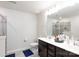 Bright bathroom featuring a double sink vanity, walk-in shower, and grey tile flooring at 5341 Orchid Bloom Dr # 55, Fort Mill, SC 29707