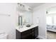 Bright bathroom featuring a double sink vanity and a large mirror at 5341 Orchid Bloom Dr # 55, Fort Mill, SC 29707