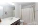 Bathroom features a single vanity, white walls, and shower with curtain at 5341 Orchid Bloom Dr # 55, Fort Mill, SC 29707