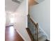 Hallway with hardwood floors, and a staircase with carpeted steps and a wooden railing at 5341 Orchid Bloom Dr # 55, Fort Mill, SC 29707