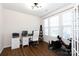 Bright home office with desk, chair, shelving, and gym equipment on hardwood floors at 5341 Orchid Bloom Dr # 55, Fort Mill, SC 29707