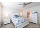 Bright main bedroom featuring a ceiling fan, nightstands, and an ensuite bathroom at 5341 Orchid Bloom Dr # 55, Fort Mill, SC 29707