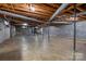 Spacious unfinished basement with utilities, concrete floor, exposed beams, ready to be personalized at 5830 W Nc 10 Hwy, Hickory, NC 28602