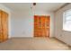 Empty bedroom featuring neutral carpet, a closet, and a window at 5830 W Nc 10 Hwy, Hickory, NC 28602