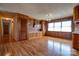 Spacious dining room featuring wood paneling, hardwood floors and built-in cabinetry at 5830 W Nc 10 Hwy, Hickory, NC 28602