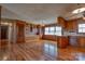 Dining area showcasing wood paneling, hardwood floors, and built-in cabinetry at 5830 W Nc 10 Hwy, Hickory, NC 28602