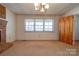 Cozy living room featuring natural light and a brick fireplace with traditional design at 5830 W Nc 10 Hwy, Hickory, NC 28602