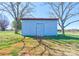 Functional metal storage shed with a weathered look, ideal for housing outdoor equipment and tools at 5830 W Nc 10 Hwy, Hickory, NC 28602