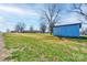 Expansive green yard with a storage shed, and mature trees offering ample outdoor space and potential at 5830 W Nc 10 Hwy, Hickory, NC 28602